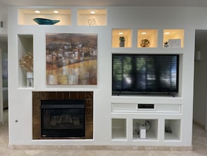 Beautiful showcase wall with gas fireplace and smart TV