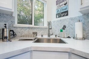 Kitchen with coffee machine and milk froster