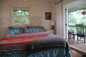 Master bedroom with king bed and access to the screened-in porch