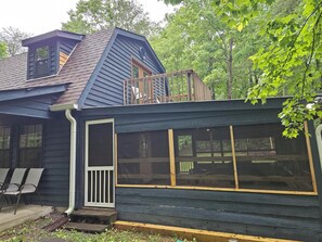 Outside of house screened in porch
