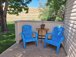 Private patio next to common area lawns