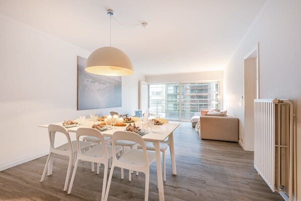 Cozy living room with dining table and sofa area