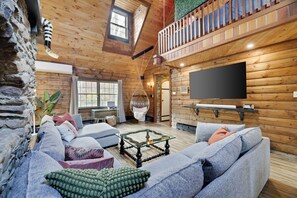 The large couch makes for a perfect entertainment space.