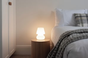 Queen bed adorned with plush bedding