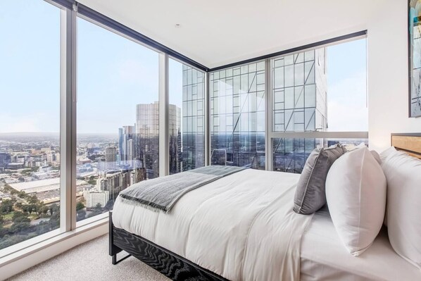 The second bedroom reveals views over the skyline and comes with a sumptuous queen-sized bed.
