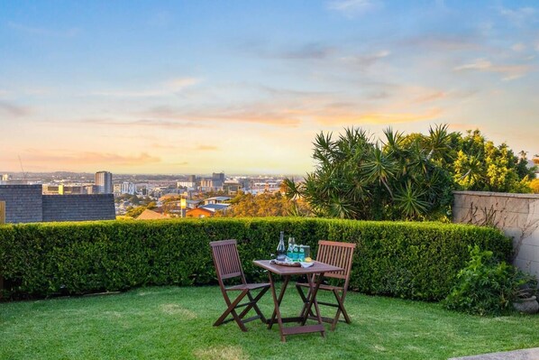 A paved patio at the rear of the property extends to a grassy, pet-friendly backyard where you can savour a sunset glass of wine and elevated views of Newcastle. 