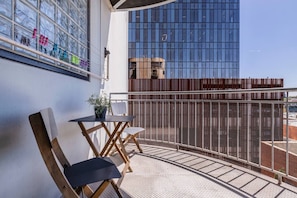 Step onto the sunny balcony with two seats, offering a delightful outdoor space to enjoy the views—plus a clothesline to conveniently hang your washing up.