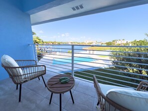 Balcony seating overlooking the pool.