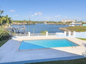 View from the balcony to the pool and canal.