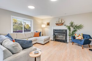 main floor living room. plenty of seating, large TV. fireplace not for use.