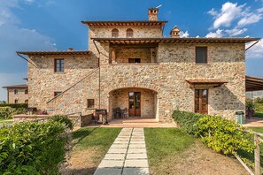 The tipical tuscan house surrounded by greenery