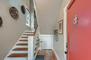 Head up the stairs to the upper unit or through the interior door to lower unit.