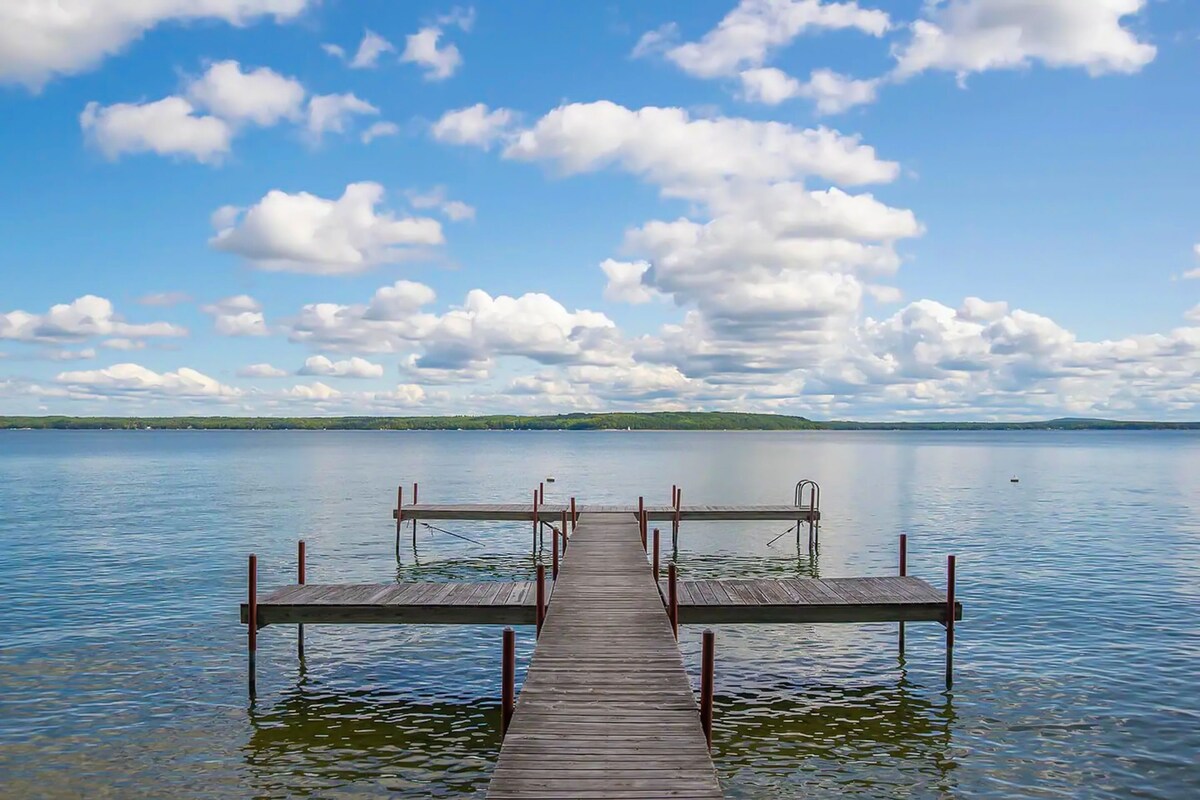 Charming lakefront cottage with large yard, dock, & fire pit – close to downtown