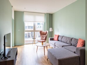 Spacious lounge with sofa and tv