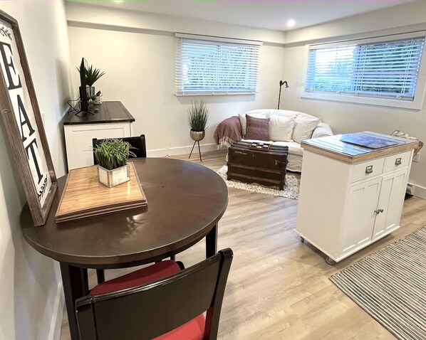 Bright, clean and cozy living room and eating area
