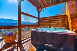 Lower floor deck: Relax and rejuvenate in the hot tub while adoring the breathtaking VIEWS