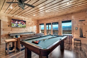 Lower floor: Don't miss a moment of your favorite TV show while enjoying games with your group: pool table, shuffleboard, bowling, arcade for 2 players