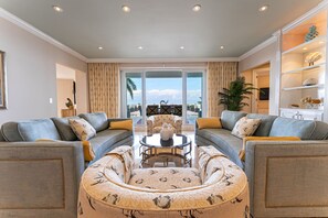 Living room w/ walk-out to 3,000 sq ft ocean view terrace