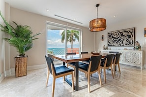 Dining room overlooking the ocean w/ walk-out patio
