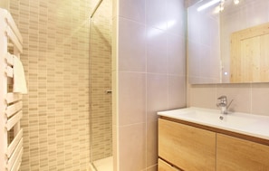 The shower room is clean and modern