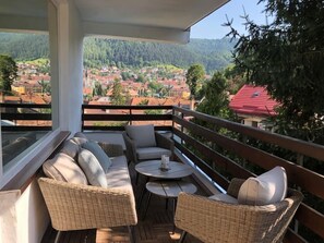 Terrace with city and mountain view