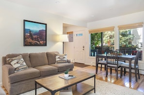 Comfortable living space with fireplace, smart TV, and pullout couch.