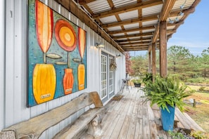 Relax on the covered front porch and admire the amazing view of the property