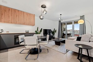 Modern meets comfort in our cozy living space, perfect for relaxation or socializing after a day of exploration.