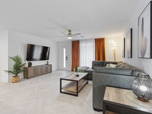 Welcome to the heart of our stylish retreat! Our living room exudes comfort and modern charm, featuring plush furnishings and contemporary decor. 
