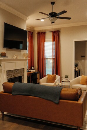 Relax in our cozy living area with plush seating and enjoy your favorite shows on a 70" Vizio 4K Smart TV at the Best Airbnb in Lake Charles.