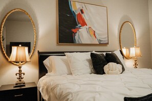 Each bedroom features a 40" Vizio Smart TV, ample storage, a body mirror, a luggage rack, and a closet with hangers. The master suite ensures a restful night's sleep on a luxurious King Serta pillowtop mattress.