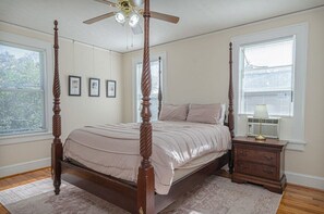 Unwind in this peaceful bedroom featuring a comfortable four-poster bed. The perfect place to rest and recharge after a long day.