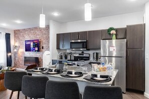 Unplug, relax, and enjoy a family meal/time around this beautifully designed kitchen island set for four.