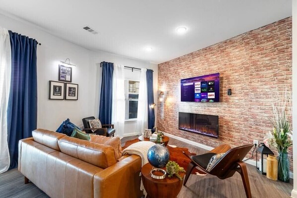 Wind down in this great space created with you in mind! Great for conversations with family and friends, relaxing, and watching a movie on the 55-inch Smart TV and fireplace.