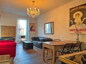 Living room with dining area and an open-planned kitchen.