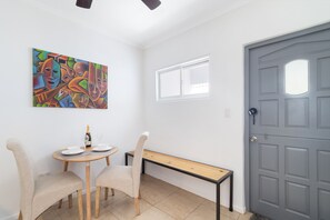 Chic Dining Area of the Apartment in Noord Aruba - Dining area for two - Quality materials, such as a sleek dining table and comfortable chairs - Harmonious color scheme for a cohesive and stylish look