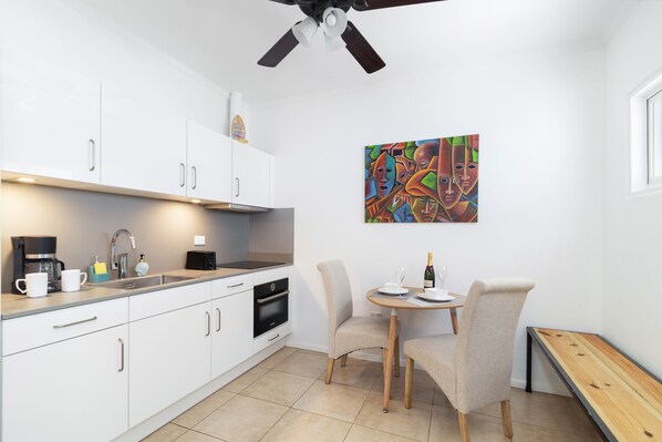Pompous Kitchen of the Apartment in Noord Aruba Near Eagle Beach - Fully Equipped - Thoughtful placement of kitchen essentials for easy access - Contemporary design with clean lines and minimalist aesthetics