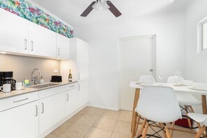 Chic Kitchen of the 2BR condo in Noord Aruba - Fully Equipped - Smart use of space with versatile storage solutions -  A kitchen that seamlessly combines style, functionality, and convenience