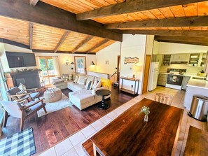 Wide open living, cooking, and dining area with natural light and breezes!