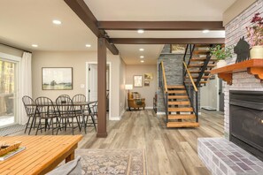 Dine, chat, or play a game at the heart of the home—this open-concept space keeps everyone connected, from kitchen to lakeview table.