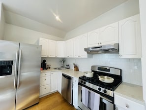Fully equipped kitchen with all you need essentials, dishwasher, stove, oven