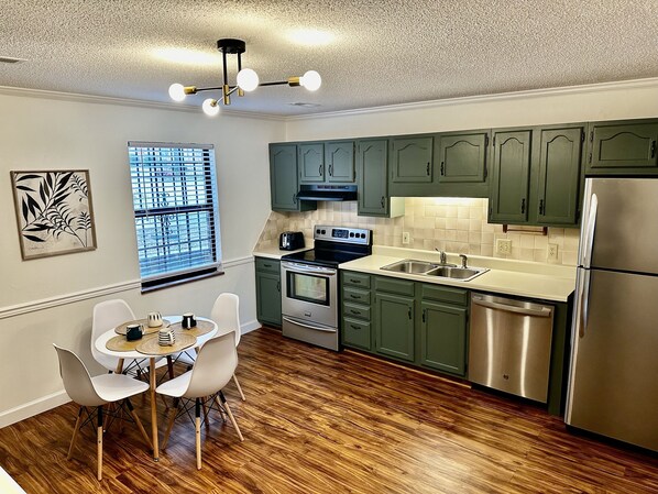 Spacious kitchen with all amenities and access to private patio