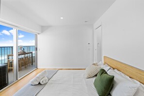 Second Bedroom features a Japandi Style Timber Queen Bed, ocean comfort