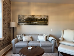 Brand new Q. size sleeper sofa. We also provide a memory foam firm topper.