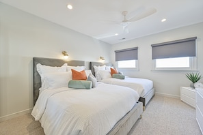 1st floor bedroom w/two full-size beds, TV, LG closet, and fresh linens!!