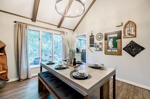 Dining Room: Gather around the table with nature views and chic decor for unforgettable meals!