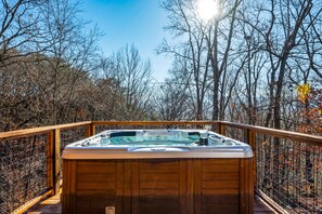 Enjoy the views from the oversized hot tub! Comfortably fits 8 adults!