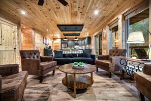 The cozy, open space concept, and modern touch of this living room welcomes you as you first open the main door.