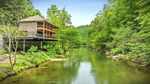 Welcome to Take Me to the River Cabin perched above the famous Little Pigeon River. Just you and your loved ones listening to the sound of water during your stay. This is what vacationing on a waterfront property feels like.