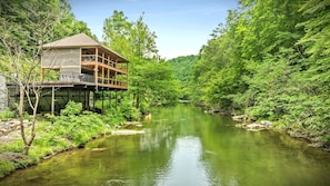 Welcome to Take Me to the River Cabin perched above the famous Little Pigeon River. Just you and your loved ones listening to the sound of water during your stay. This is what vacationing on a waterfront property feels like.